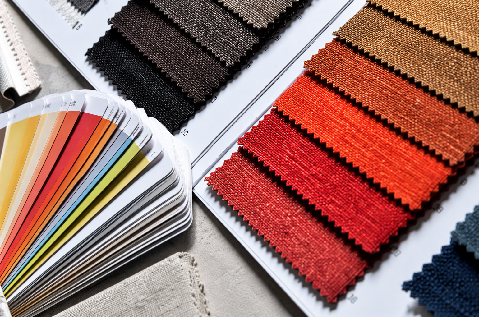 Cut fabric swatch strips in shades of red, pink, yellow and teal